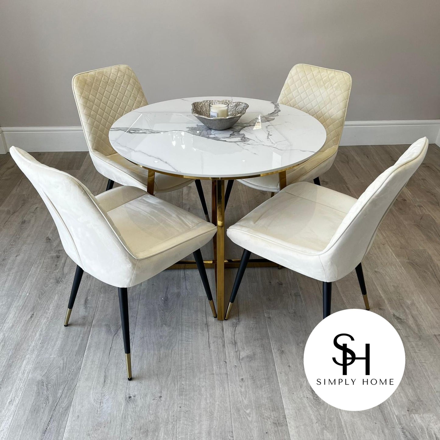 Julio Circular White Marble Dining table with Cream Milano Dining Chairs