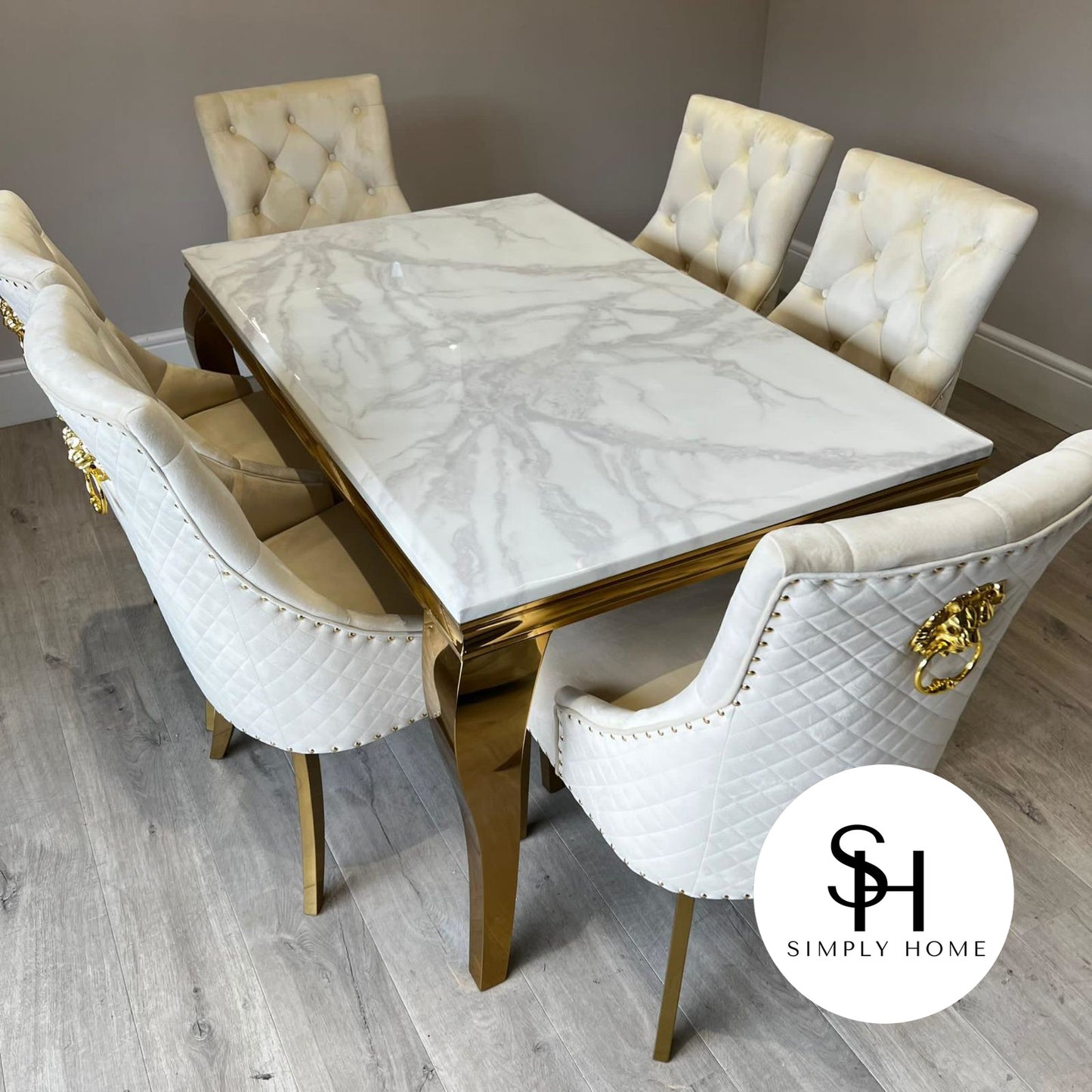 Riviera Gold White Marble Dining Table with Cream and Gold Leo Chairs