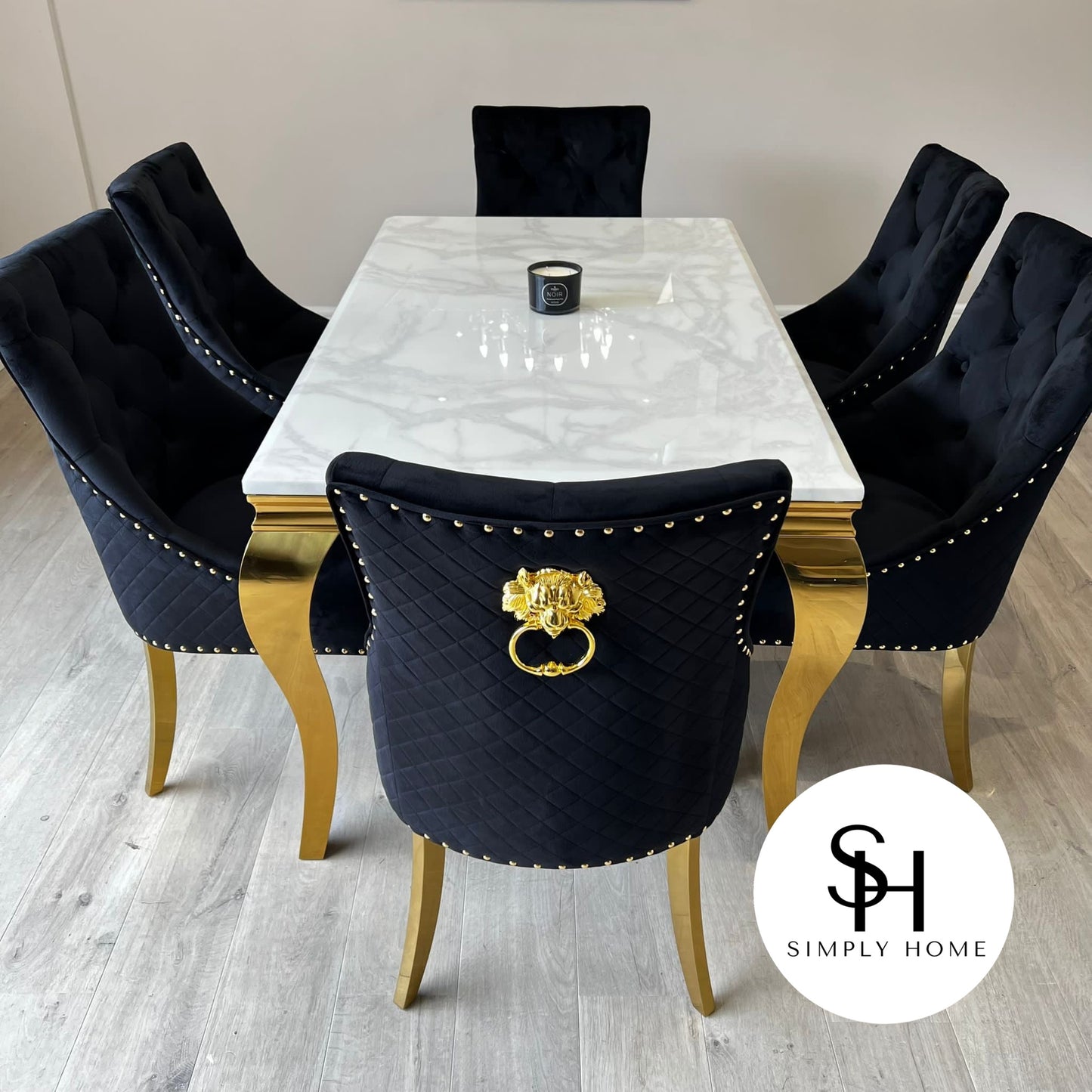 Riviera Gold White Marble Dining Table with Black and Gold Leo Chairs