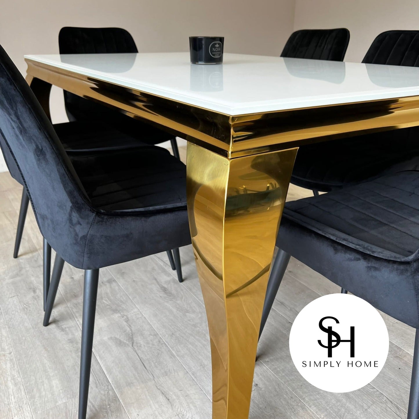 Riviera Gold White Glass Dining Table with Black Luca Chairs