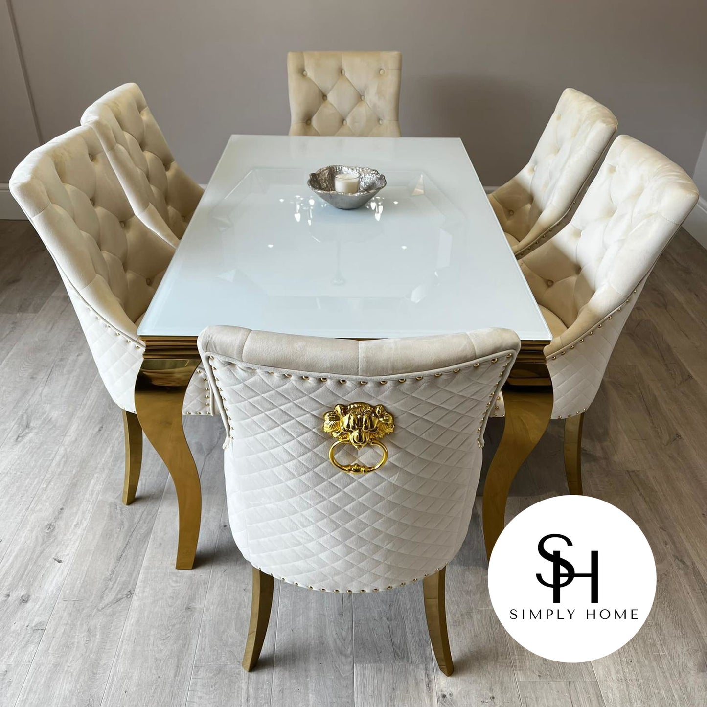 Riviera Gold White Glass Dining Table with Cream and Gold Leo Chairs
